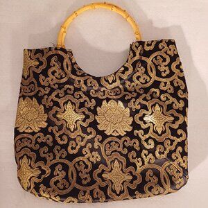 Black & golden handbag with rattan/bamboo? handles